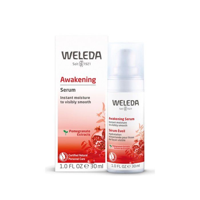 Botella de Weleda Awakening Serum junto a la caja del producto sobre un fondo blanco.